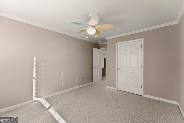 unfurnished bedroom with light carpet, ceiling fan, and crown molding