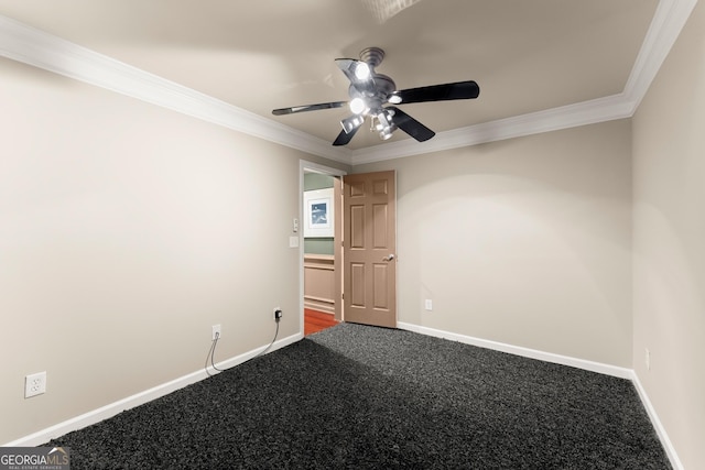 spare room with ceiling fan, carpet, and crown molding