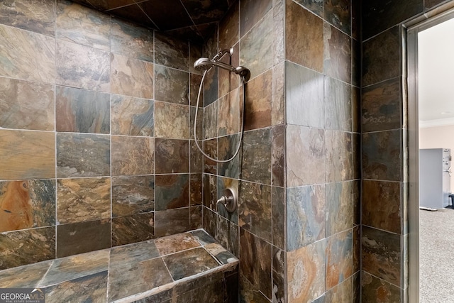 bathroom featuring a tile shower