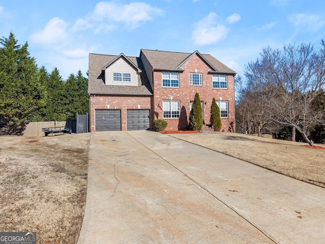 view of front property featuring a front yard and a garage