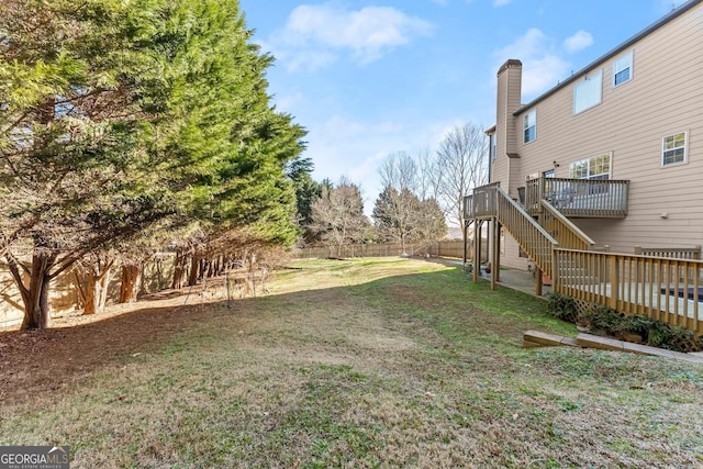 view of yard with a wooden deck