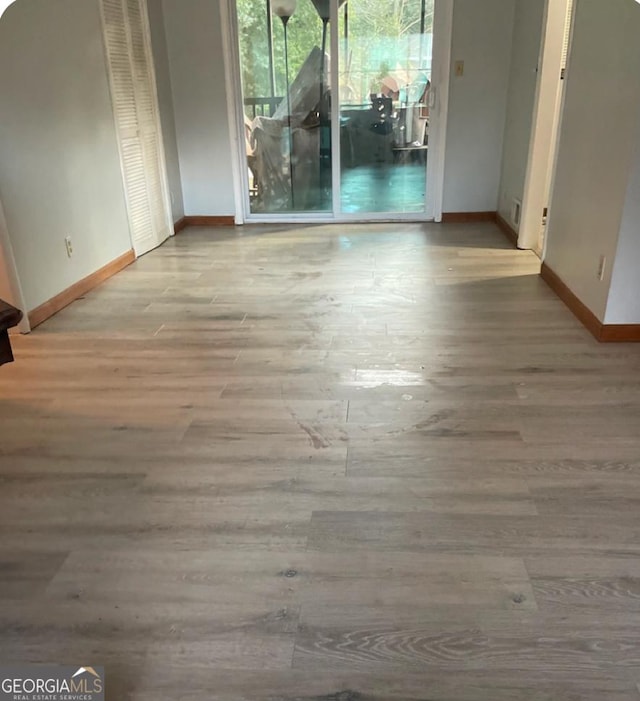 unfurnished dining area featuring light hardwood / wood-style flooring