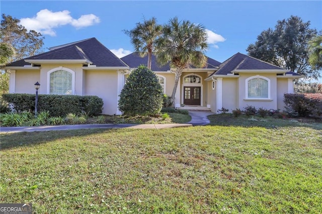 single story home with a front lawn