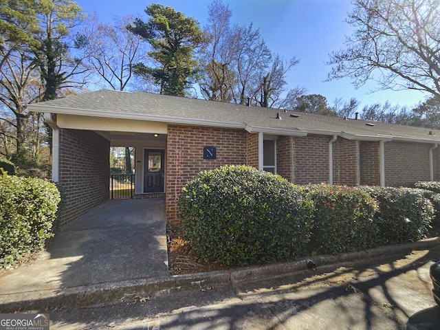 view of front facade with a carport