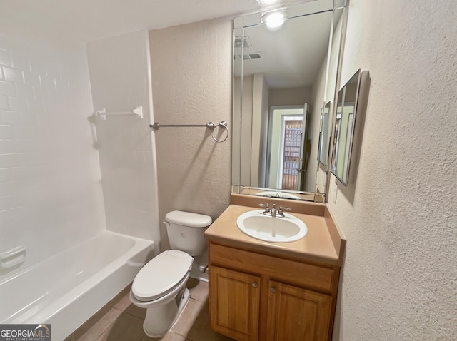 full bathroom featuring washtub / shower combination, vanity, and toilet