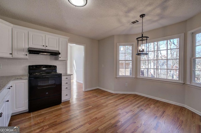 kitchen featuring backsplash, black range with electric stovetop, light hardwood / wood-style floors, light stone counters, and white cabinetry