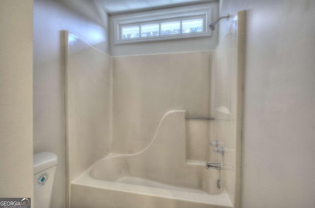 bathroom featuring washtub / shower combination