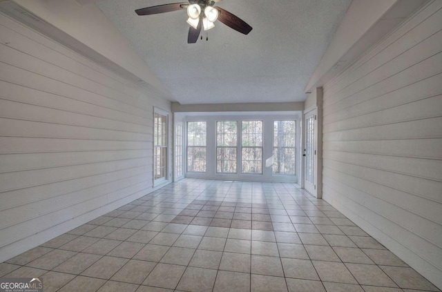 interior space featuring ceiling fan and lofted ceiling