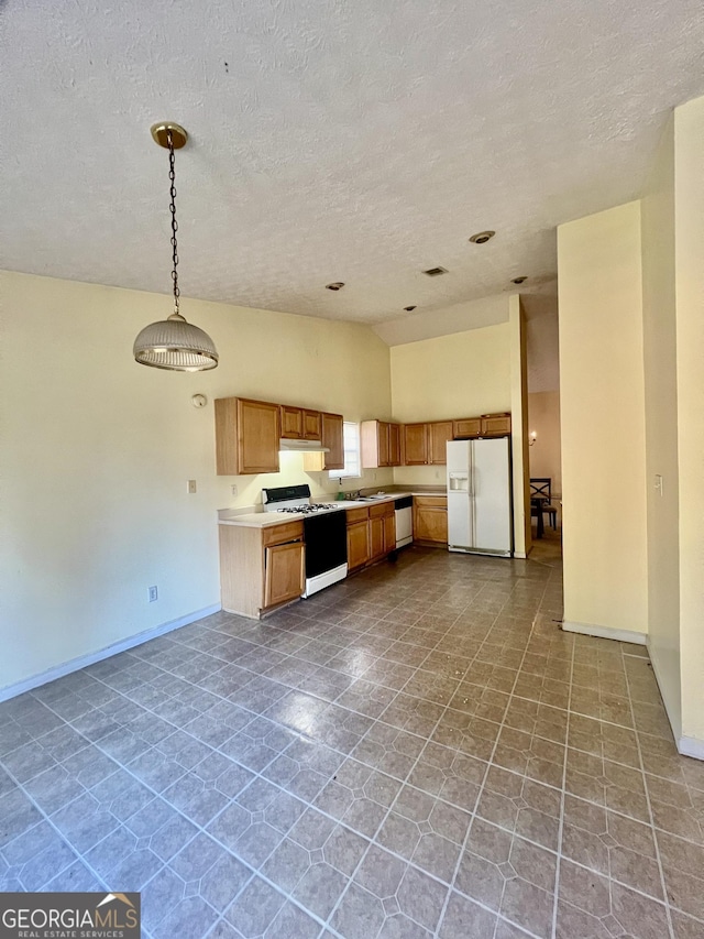 kitchen featuring dishwasher, hanging light fixtures, white refrigerator with ice dispenser, gas range oven, and a textured ceiling