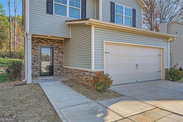 property entrance with a garage