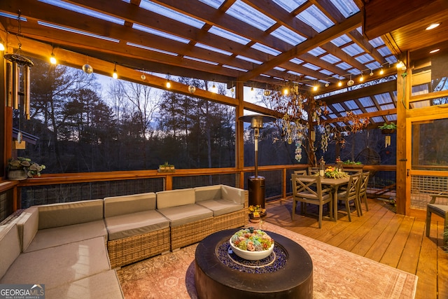 wooden deck with a pergola and outdoor lounge area