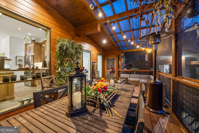 wooden deck with a pergola and outdoor lounge area