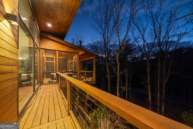 wooden terrace with a sunroom