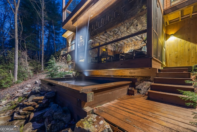 exterior space with a covered hot tub