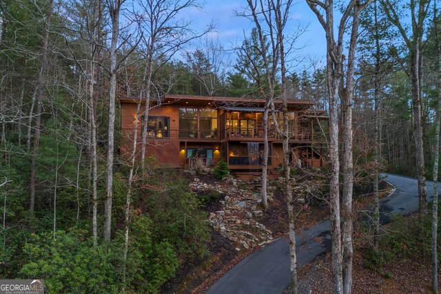 back of property with a wooden deck