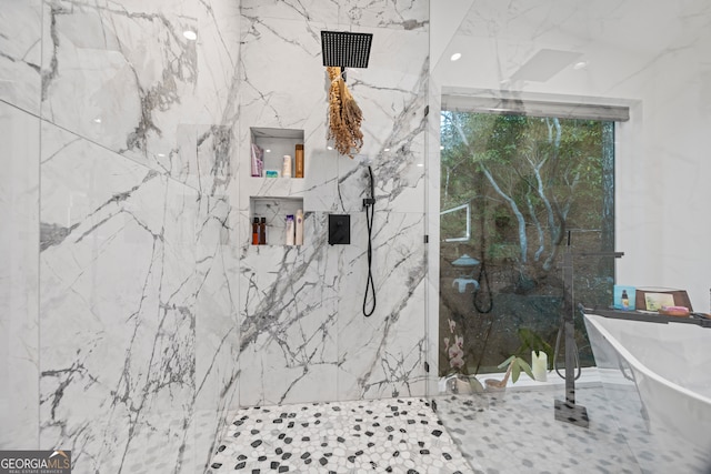 bathroom featuring separate shower and tub