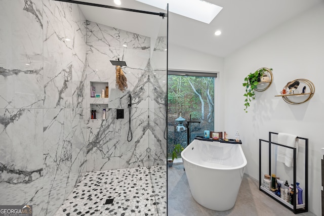 bathroom featuring concrete floors, lofted ceiling with skylight, and plus walk in shower