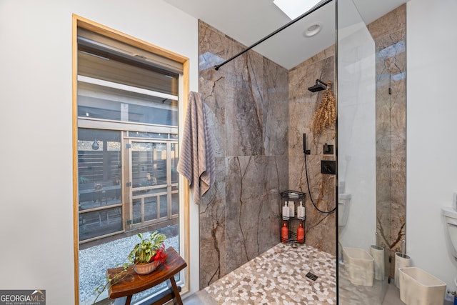 bathroom with a tile shower