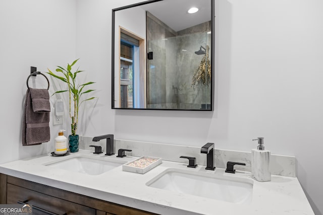 bathroom featuring vanity and a shower with door