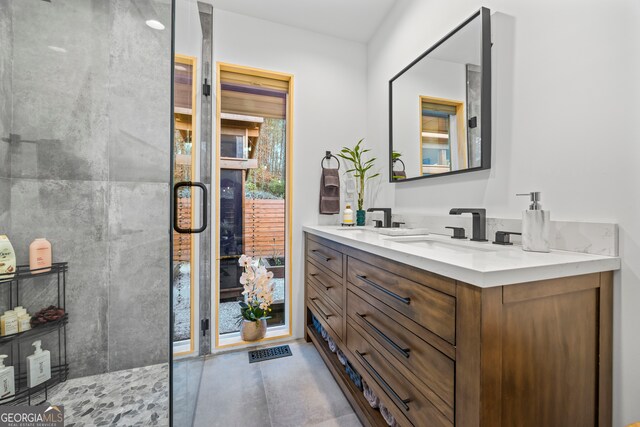 bathroom with vanity and a shower