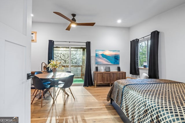 bedroom with ceiling fan, access to exterior, and light hardwood / wood-style floors