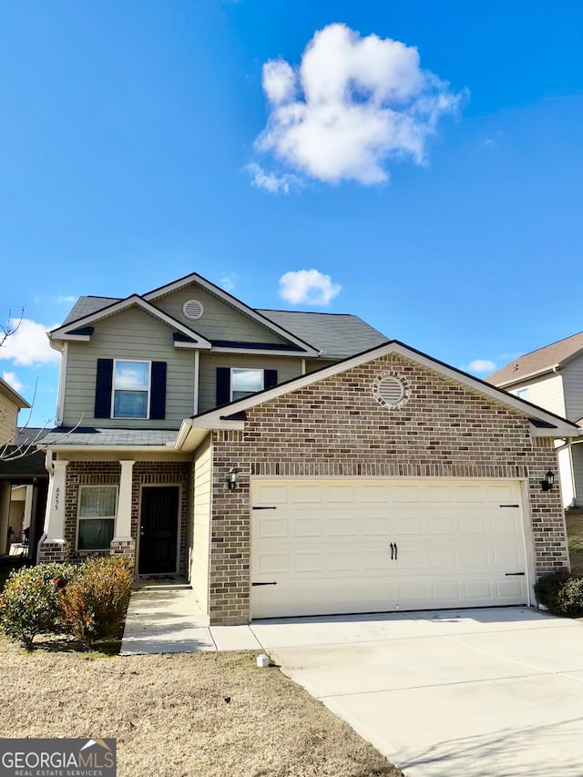 front of property with a garage