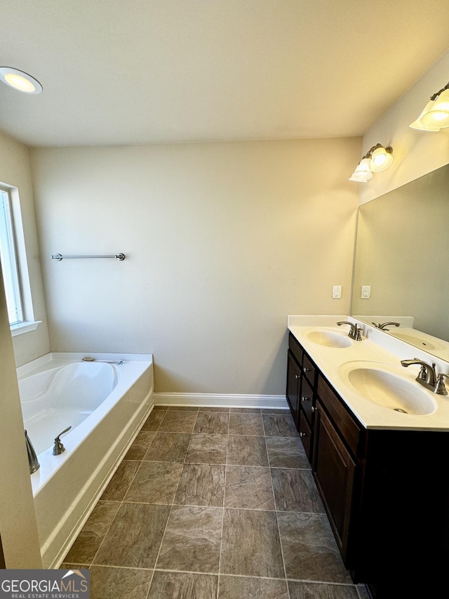 bathroom with a bathing tub and vanity