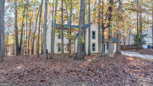 view of property hidden behind natural elements