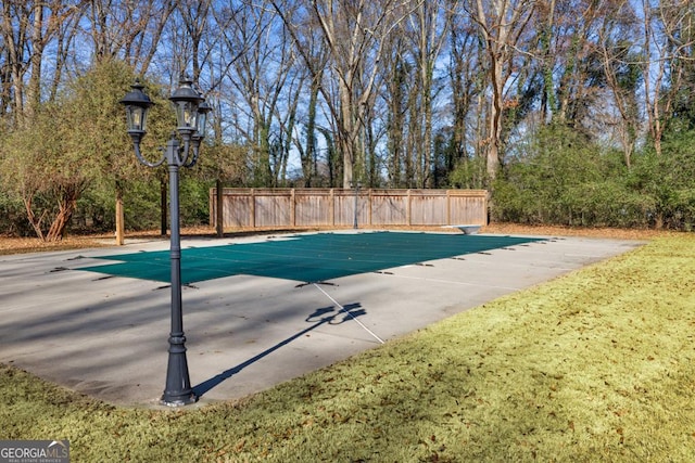 view of pool featuring a diving board