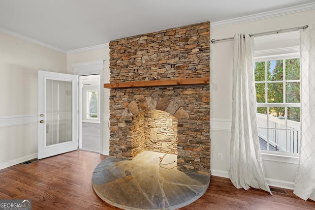 living room featuring plenty of natural light and dark hardwood / wood-style flooring