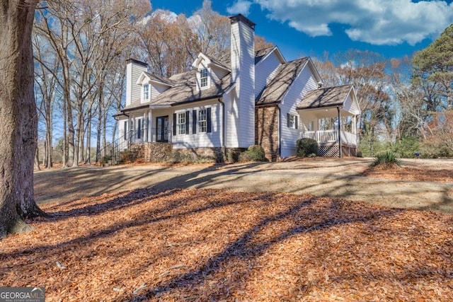 cape cod house with a porch