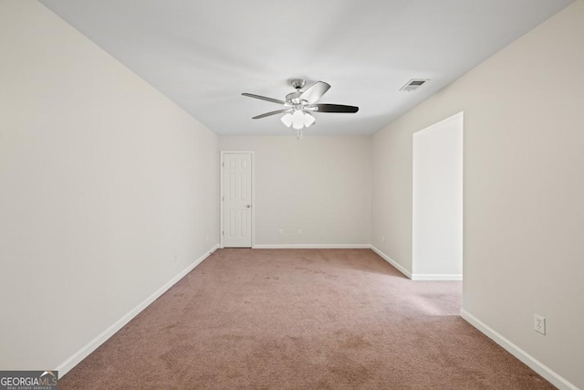 carpeted empty room with ceiling fan