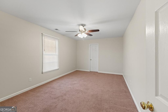 carpeted empty room with ceiling fan