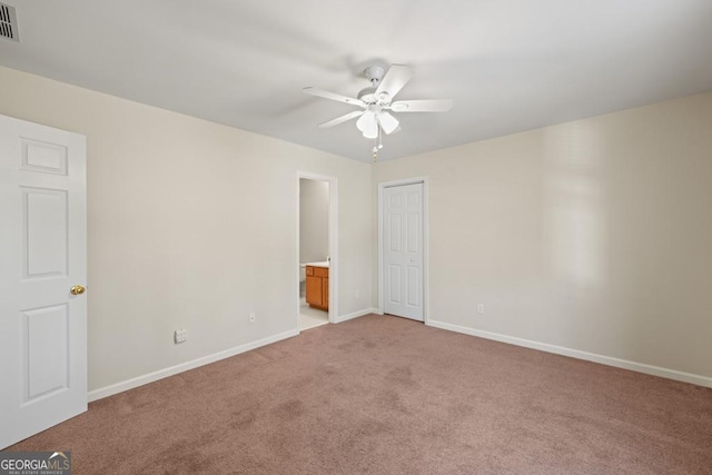 unfurnished room featuring ceiling fan and light carpet