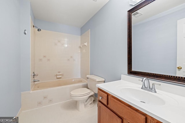 full bathroom with tile patterned flooring, vanity, toilet, and tiled shower / bath combo