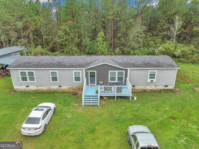 view of front of property with a front lawn and a wooden deck