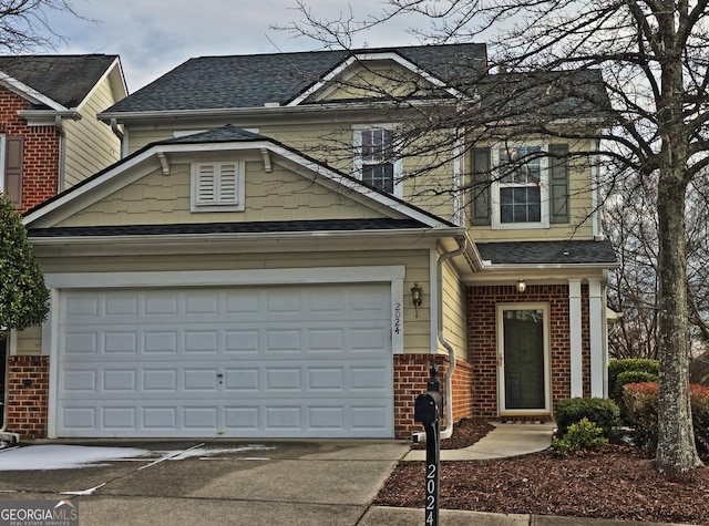 view of front of property with a garage