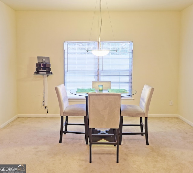 view of carpeted dining space