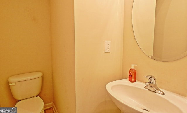 bathroom with sink and toilet