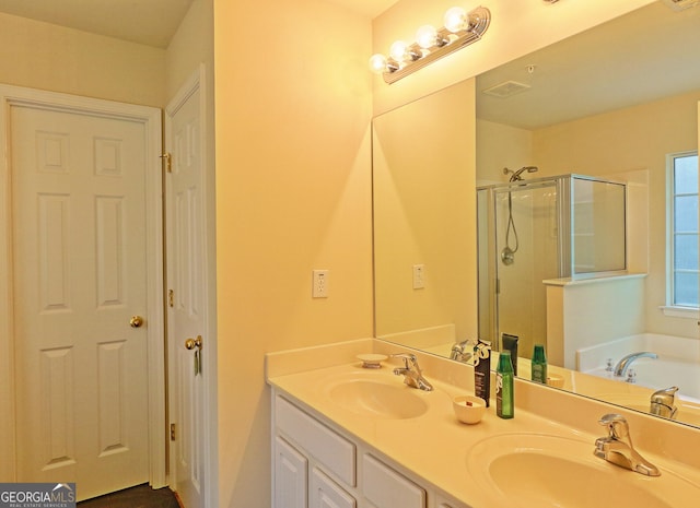 bathroom with vanity and plus walk in shower