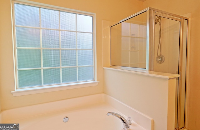 bathroom with plus walk in shower and plenty of natural light