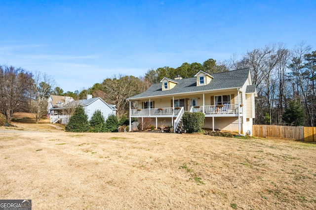 view of front of house featuring a front lawn and covered porch