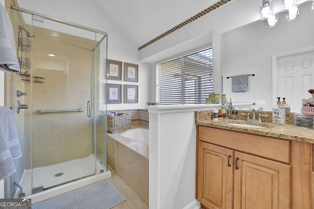 bathroom featuring separate shower and tub, tile patterned flooring, vanity, and lofted ceiling