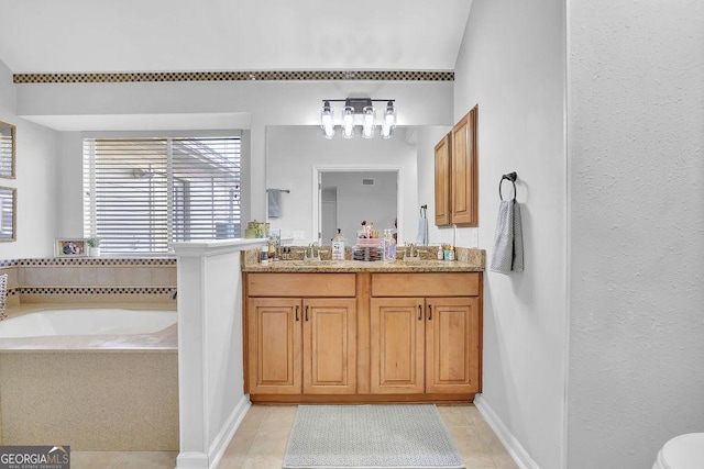 bathroom with tile patterned flooring, vanity, and a tub to relax in