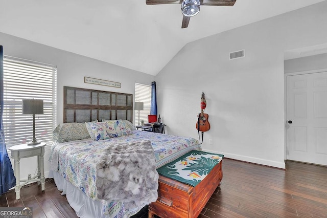 bedroom featuring ceiling fan, dark wood-type flooring, and lofted ceiling