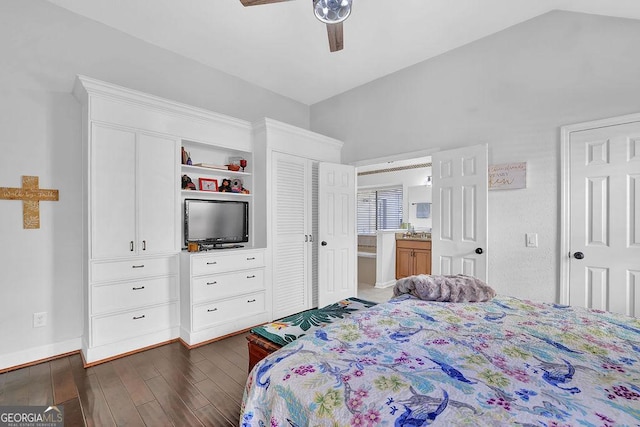 bedroom featuring dark hardwood / wood-style floors, vaulted ceiling, ceiling fan, and sink