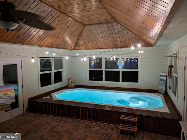 view of pool with a hot tub and ceiling fan