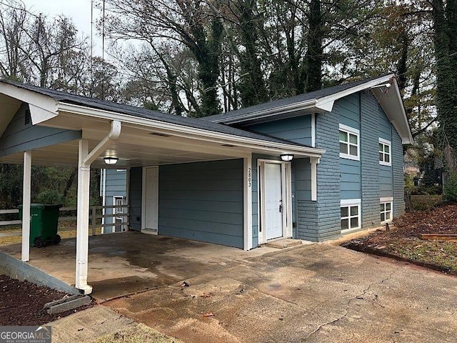 view of property exterior featuring a carport