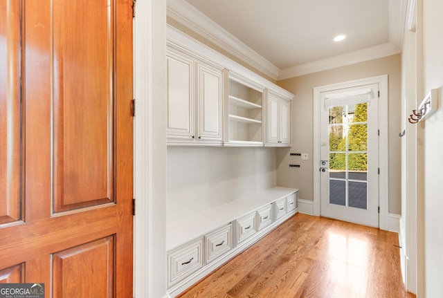 mudroom featuring ornamental molding and light wood-type flooring