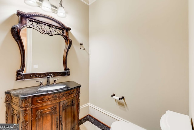 bathroom featuring tile patterned floors, vanity, and toilet